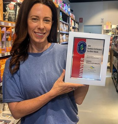 Coco holding the 2026 Randwick City Business Excellence Award